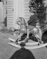Windmill_A E S on rocking horse 241 McKillop St_Film No 95-3_Oct 1922_cropped